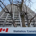 Statistical charts on computer screen representing national data analysis